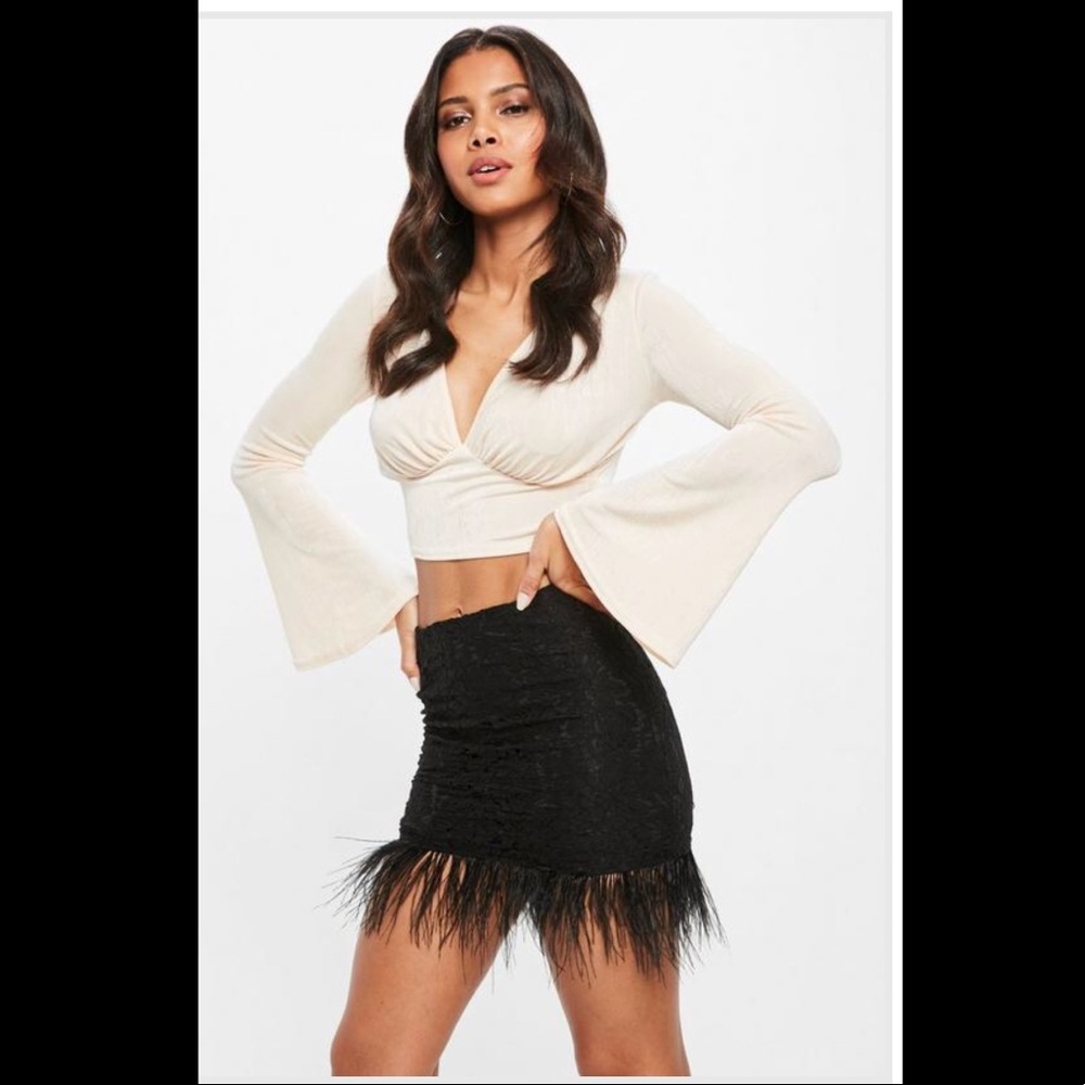 Black lace feather hem skirt .

New with no tag